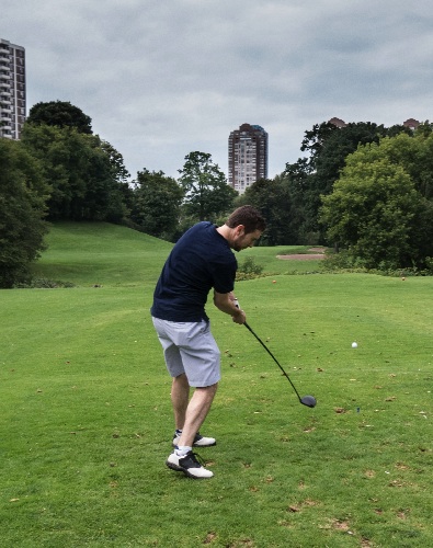 David Tulumello's fires off a drive on the 8th tee